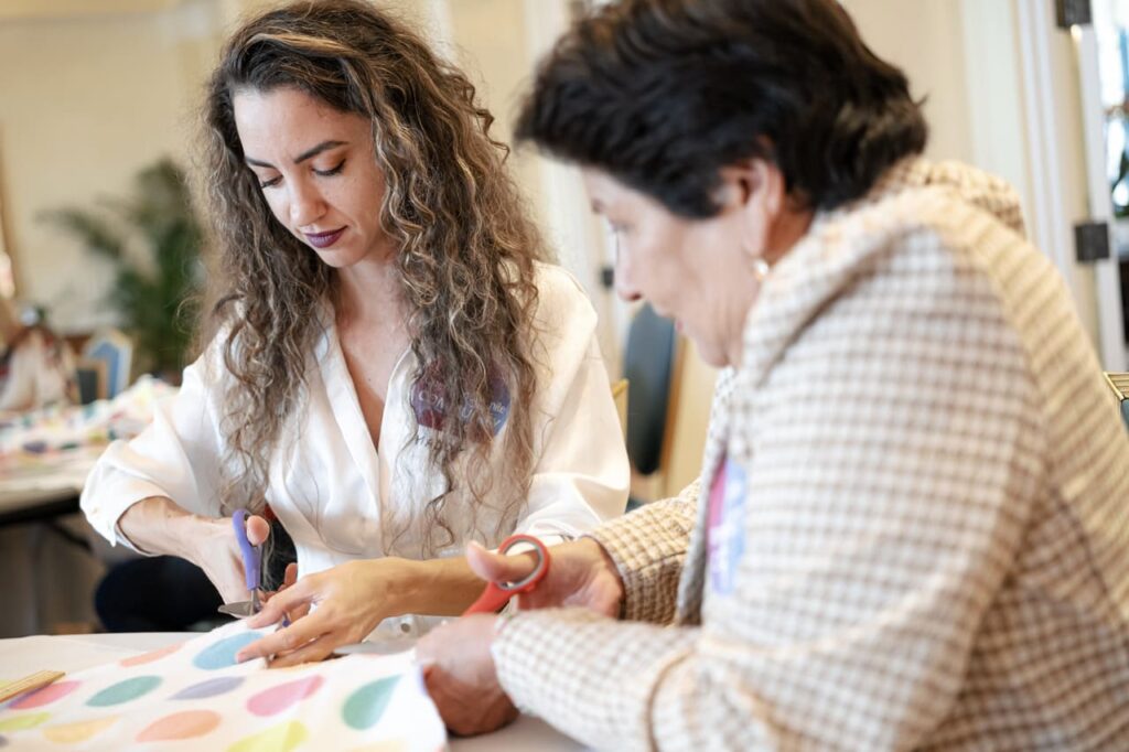 GFWC Operation Smile Miami, The Miami Woman's Club Day of Service, Operation Smile Blanket Drive, No-Sew Fleece Blankets GFWC, Smile Bags creation, Operation Smile Patients Support, Armando Paz Guest Speaker, The Paz Foundation Sponsorship, Community Service Miami.